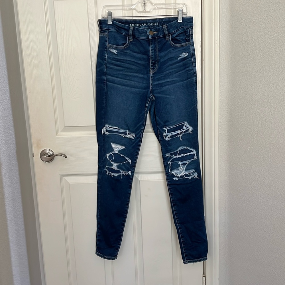 Women’s American Eagle distressed dark wash high rise jegging (10 Long)